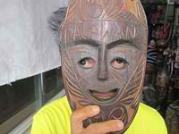 palawan wood carvings person holding mask